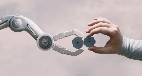 Human hand interacting with a robotic arm